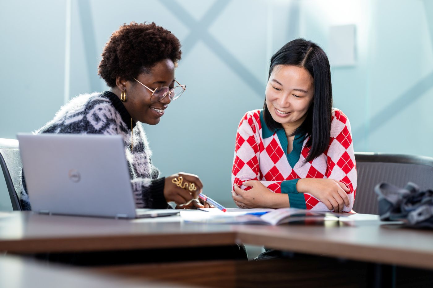black woman and asian woman engaged in mentorship