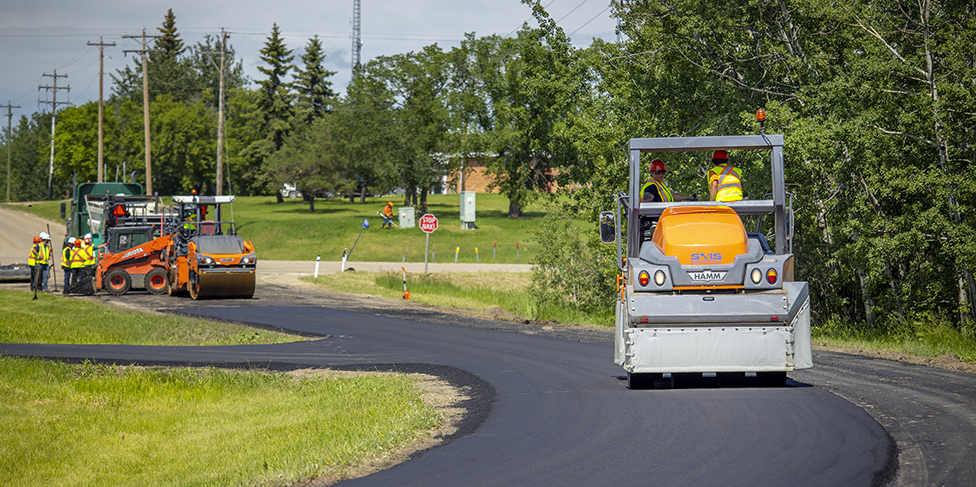Laying asphalt in a rural location