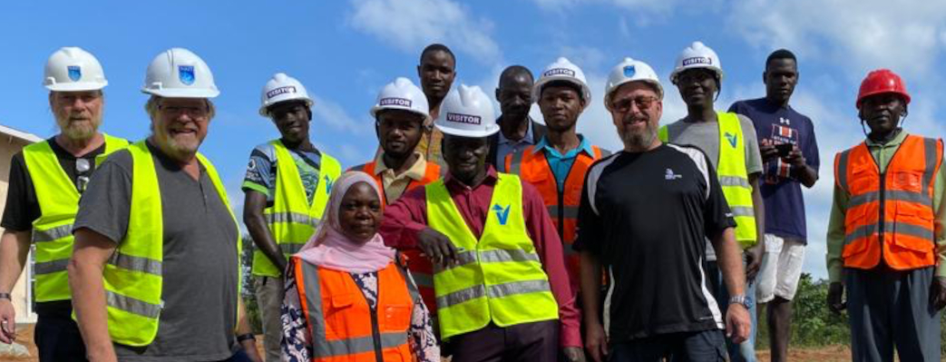 Thirteen people both students and instructors from NAIT plumbing and electrical international training