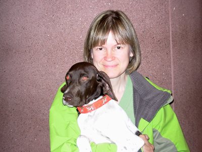 Endowment donor Carla Cumming Sojonky holds her dog, a German shorthaired pointer.