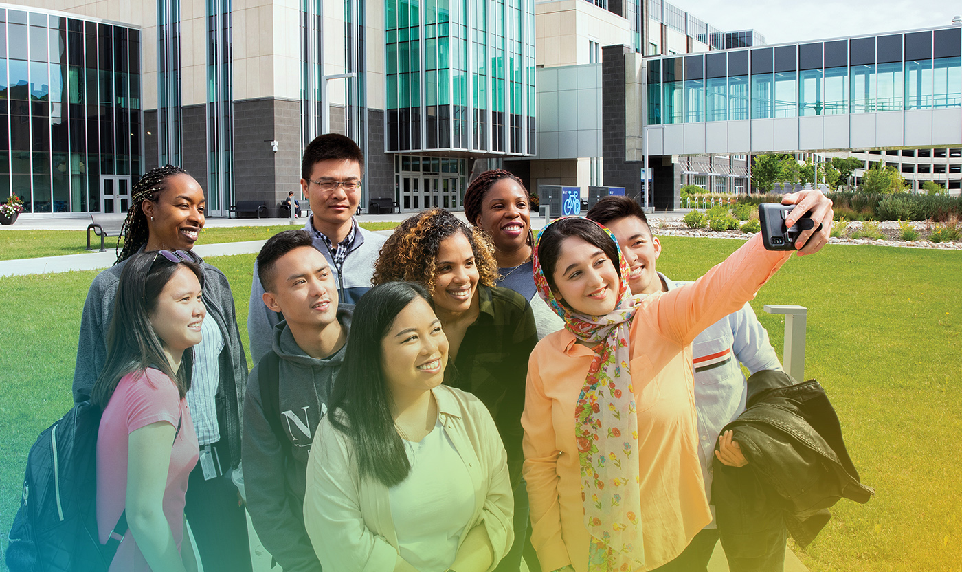 Ethnically diverse group of students taking a selfie