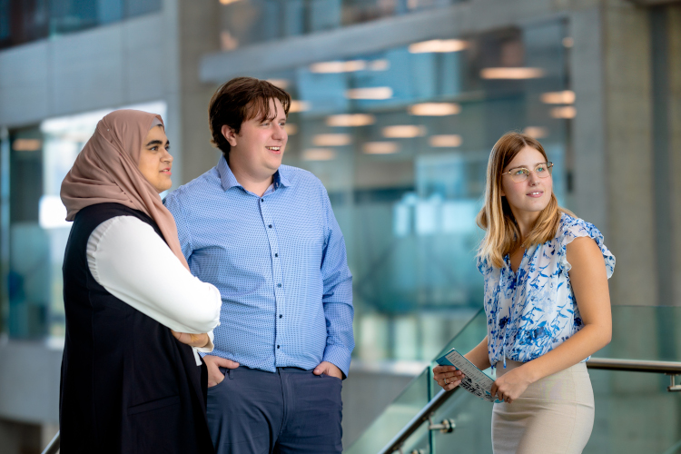 three human resource students on the NAIT campus